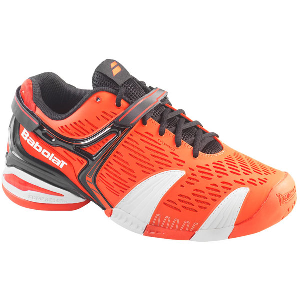 orange and black tennis shoes